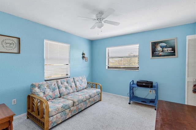 living room with carpet flooring and ceiling fan