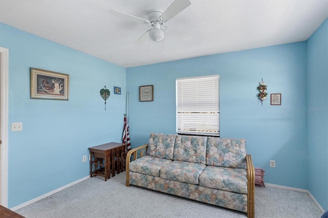 carpeted living room with ceiling fan