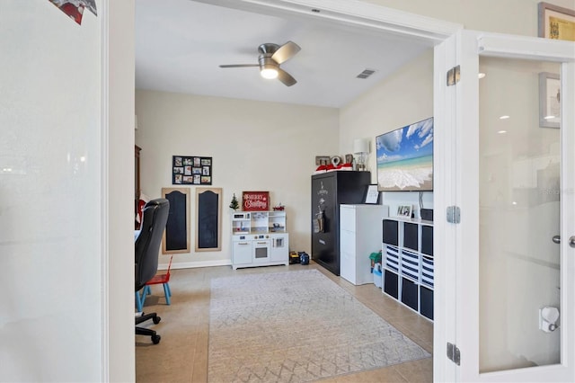 tiled home office with ceiling fan