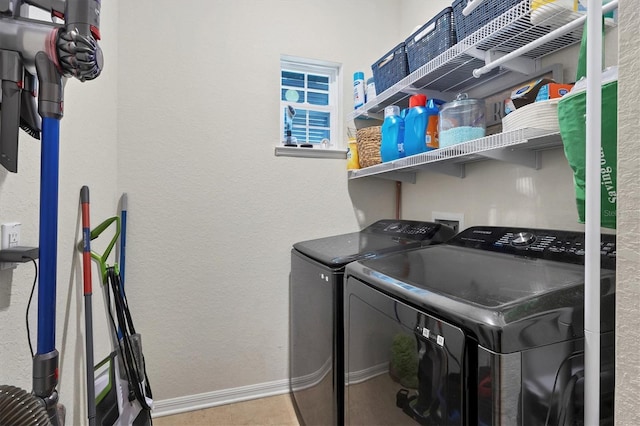 clothes washing area featuring independent washer and dryer