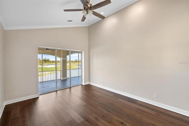 empty room featuring ceiling fan, dark hardwood / wood-style flooring, and crown molding