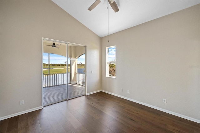 spare room featuring dark hardwood / wood-style flooring, high vaulted ceiling, and ceiling fan