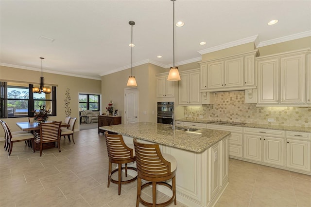 kitchen with black appliances, crown molding, light stone countertops, and decorative light fixtures