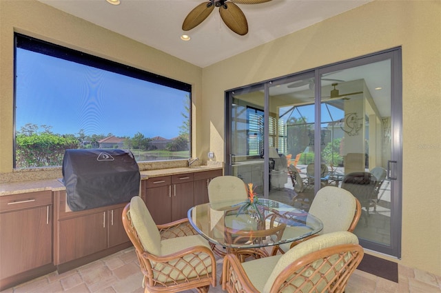 sunroom / solarium with ceiling fan