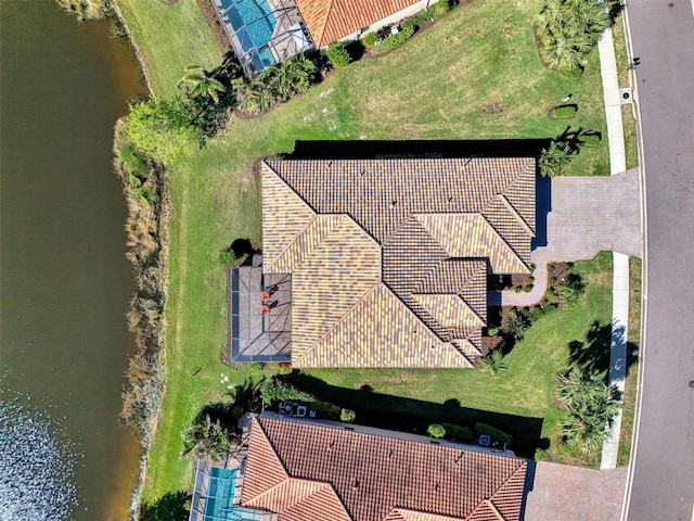 birds eye view of property featuring a water view