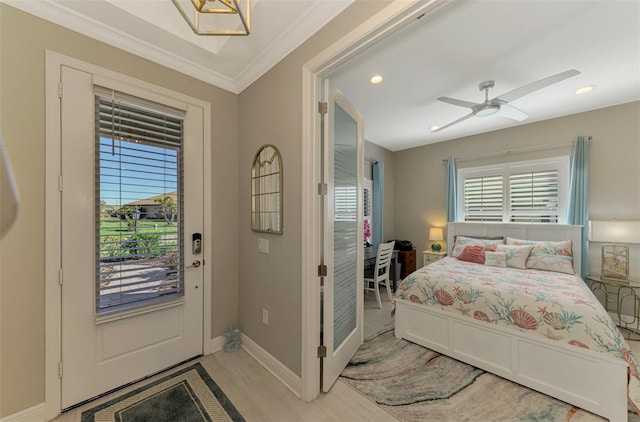 bedroom with multiple windows, ceiling fan, crown molding, and access to exterior