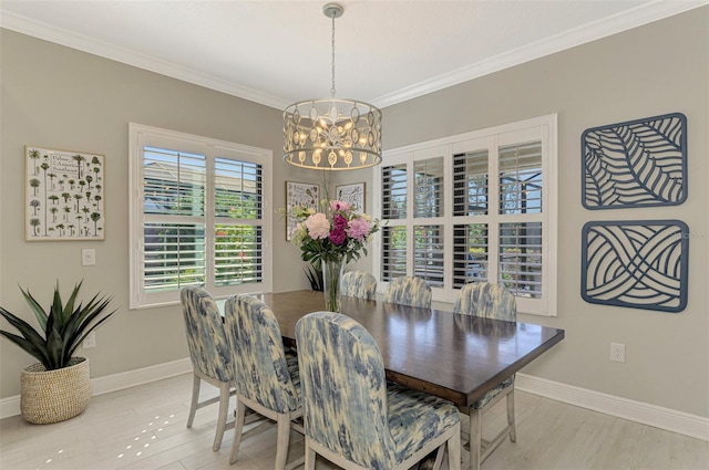 dining room featuring crown molding and a notable chandelier