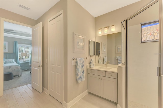 bathroom with vanity and an enclosed shower