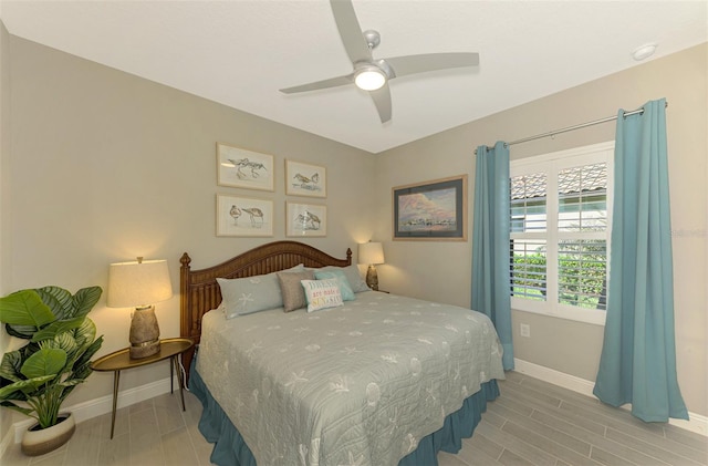 bedroom with hardwood / wood-style flooring and ceiling fan