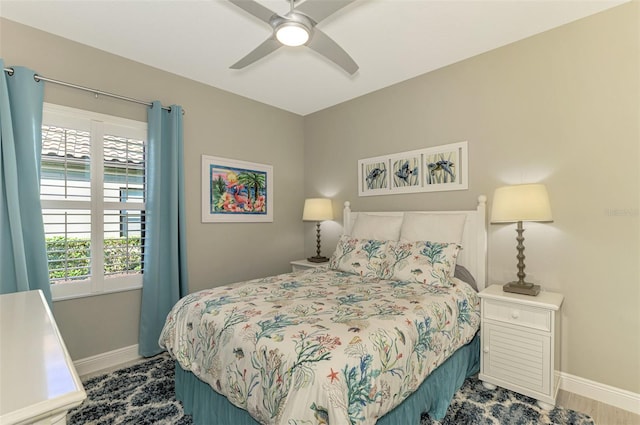 bedroom featuring ceiling fan and wood-type flooring