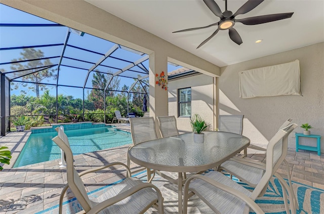 exterior space featuring a patio area, ceiling fan, and a lanai