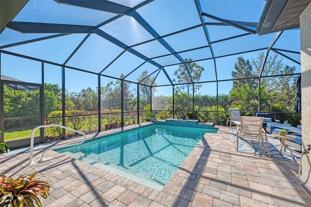 view of pool with a lanai and a patio