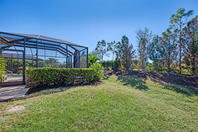 view of yard with glass enclosure