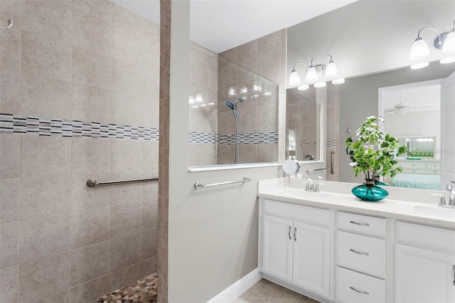 bathroom featuring vanity and a tile shower