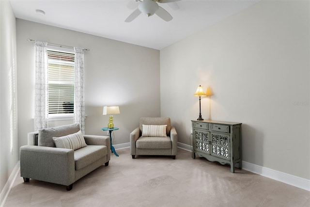 living area featuring ceiling fan