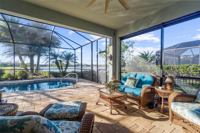 view of swimming pool with a water view, a lanai, ceiling fan, an outdoor hangout area, and a patio