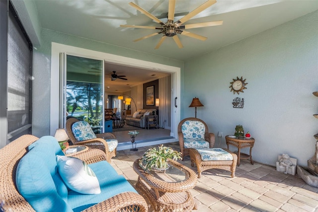 view of patio featuring ceiling fan