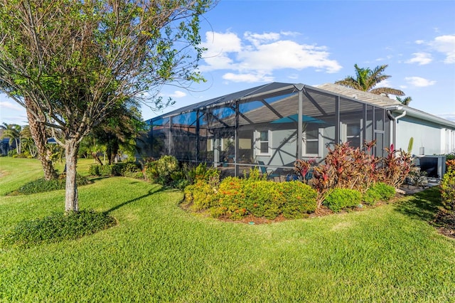 view of yard with glass enclosure