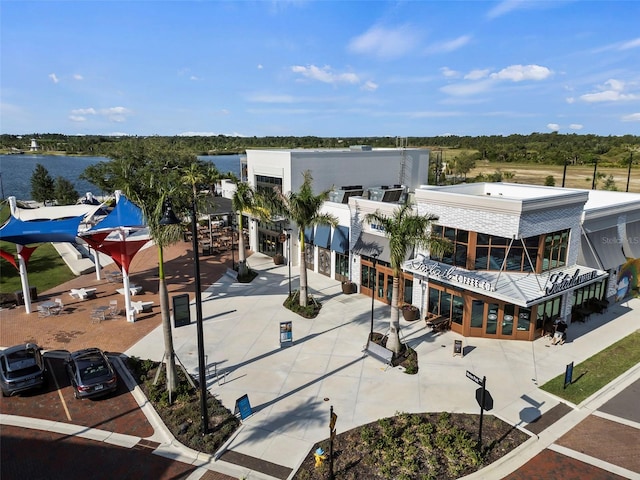 birds eye view of property with a water view