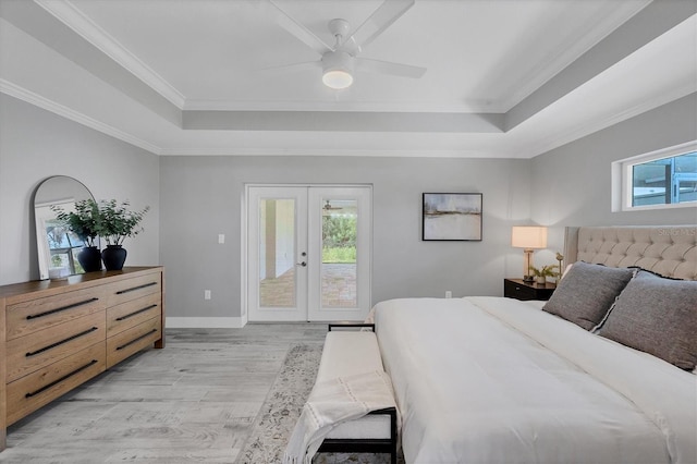 bedroom with access to exterior, french doors, multiple windows, and light wood-type flooring