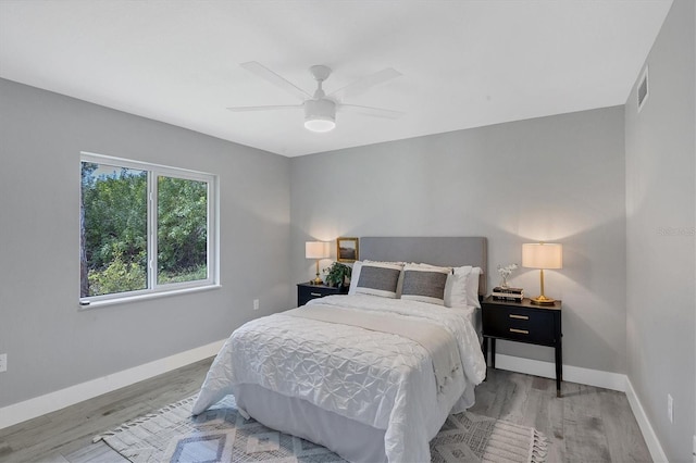 bedroom featuring hardwood / wood-style flooring and ceiling fan