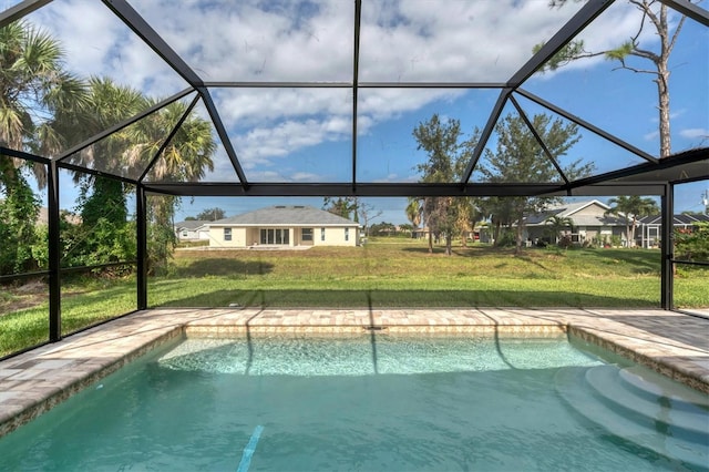 view of swimming pool with a yard and glass enclosure