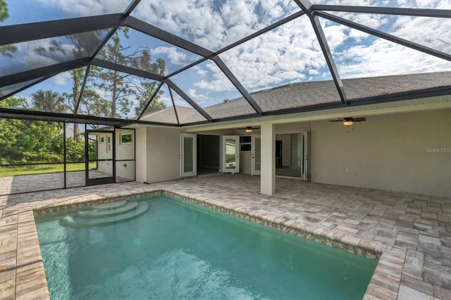 view of pool featuring ceiling fan, a lanai, and a patio