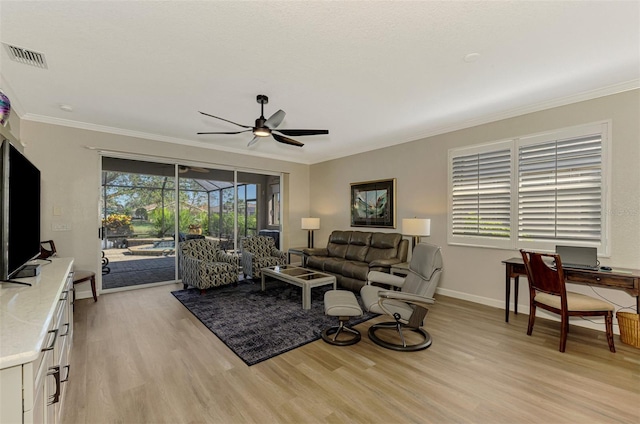 living room with crown molding, ceiling fan, and light hardwood / wood-style floors