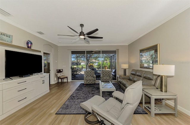 living room with light hardwood / wood-style flooring, ceiling fan, and ornamental molding