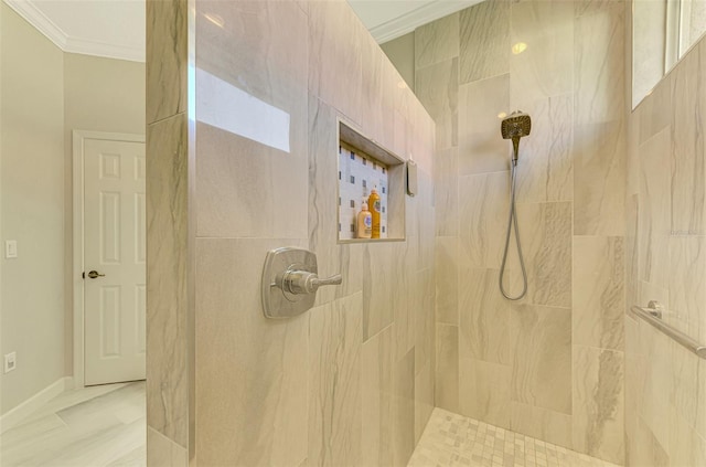 bathroom featuring tiled shower and ornamental molding