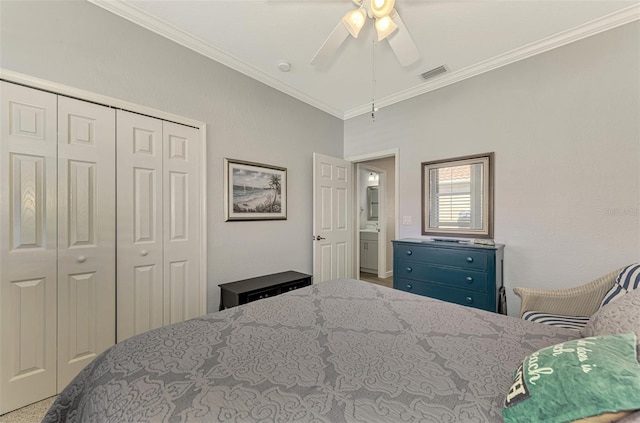 bedroom with carpet, a closet, ceiling fan, and crown molding