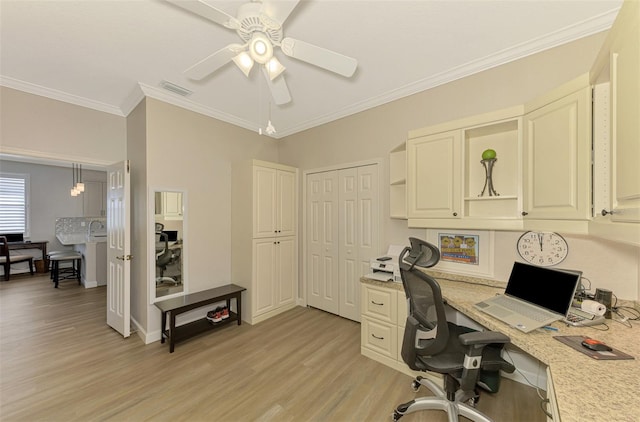 office space with crown molding, ceiling fan, and light wood-type flooring