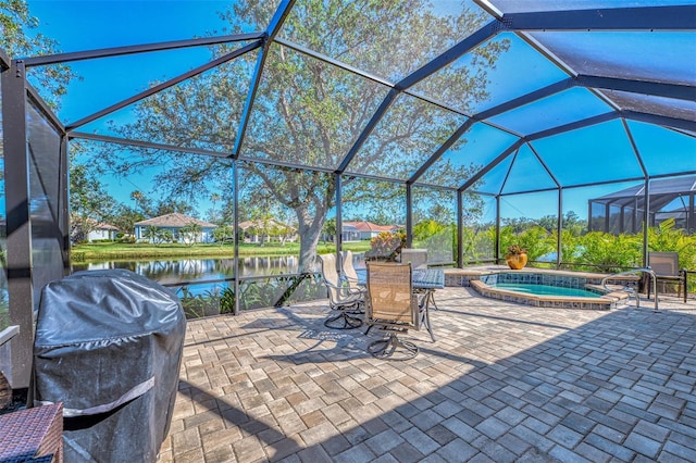 view of patio with glass enclosure, an in ground hot tub, a water view, and a grill