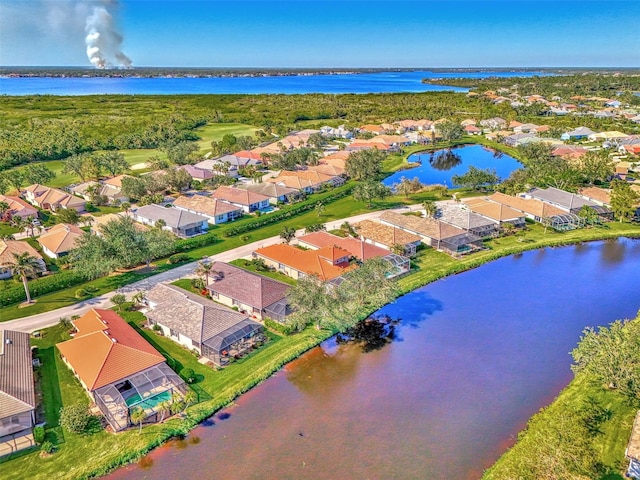 birds eye view of property with a water view