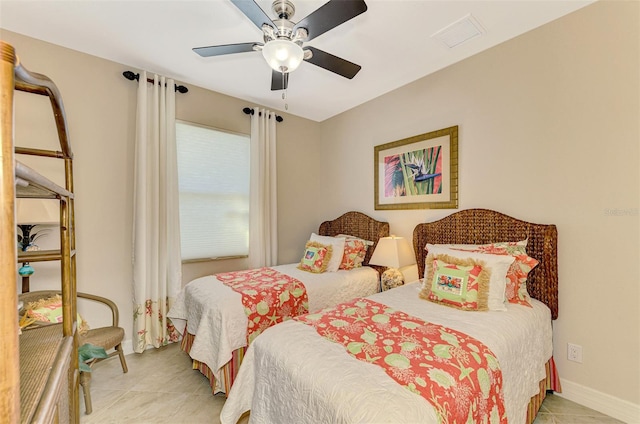 tiled bedroom with ceiling fan