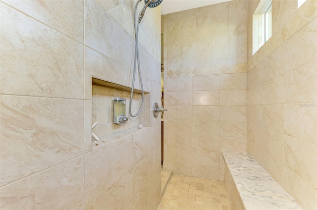 bathroom featuring tiled shower