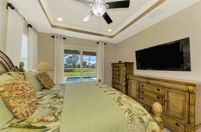 bedroom with ceiling fan, crown molding, access to outside, and a tray ceiling