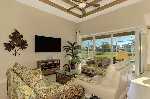 living room featuring ceiling fan and light tile patterned floors