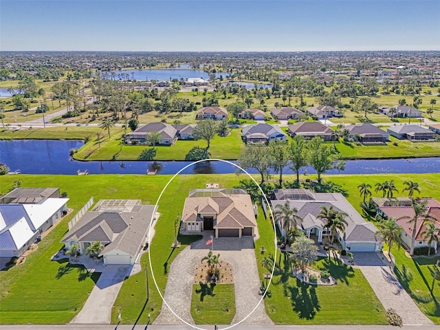 birds eye view of property with a water view