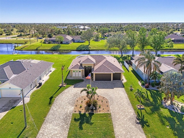 birds eye view of property with a water view