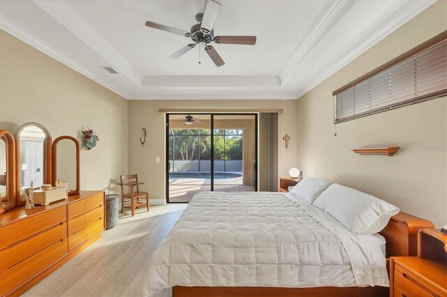 2 Marker Rd, Rotonda West, FL 33947 - bedroom with a tray ceiling, light wood-style floors, access to outside, crown molding, and ceiling fan