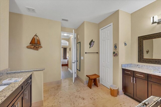 2 Marker Rd, Rotonda West, FL 33947 - full bath featuring ensuite bathroom, two vanities, and baseboards