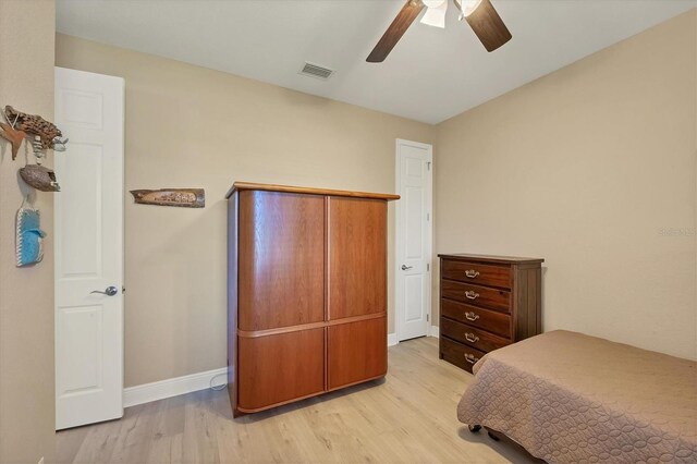 2 Marker Rd, Rotonda West, FL 33947 - bedroom featuring light wood finished floors, baseboards, and a ceiling fan