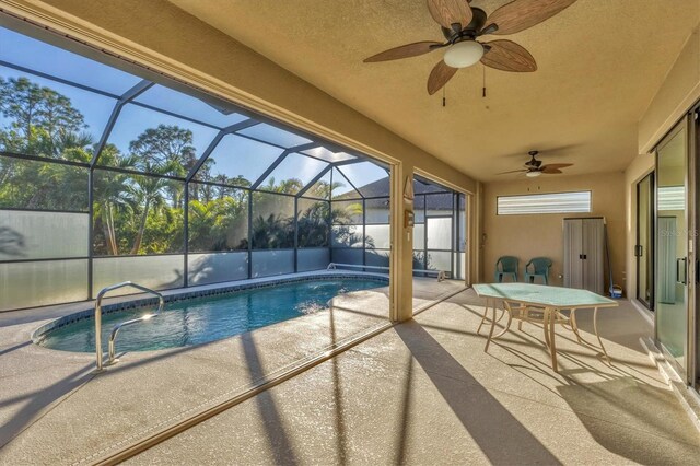 2 Marker Rd, Rotonda West, FL 33947 - swimming pool with a patio, ceiling fan, and glass enclosure