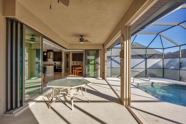 2 Marker Rd, Rotonda West, FL 33947 - view of patio featuring ceiling fan, an outdoor pool, and a lanai