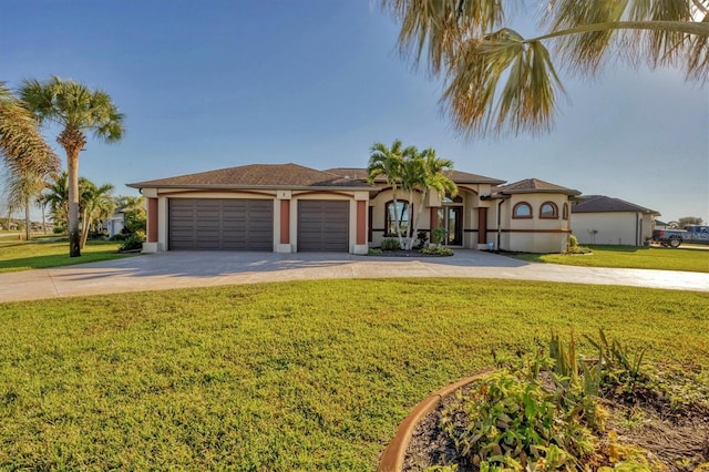 2 Marker Rd, Rotonda West, FL 33947 - mediterranean / spanish home with concrete driveway, a front lawn, stucco siding, and a garage