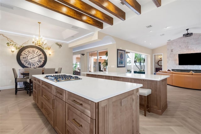 kitchen featuring an inviting chandelier, vaulted ceiling with beams, light parquet floors, decorative light fixtures, and a kitchen island