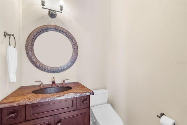 bathroom with vanity and toilet