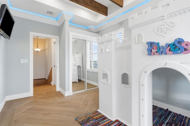 interior space with beamed ceiling and parquet flooring