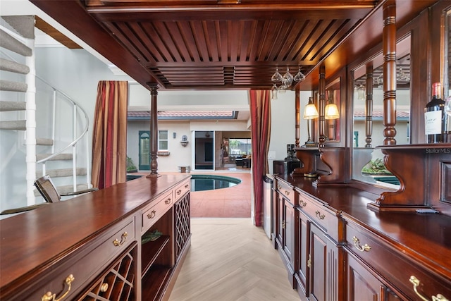 bar featuring beam ceiling, decorative light fixtures, and wooden ceiling